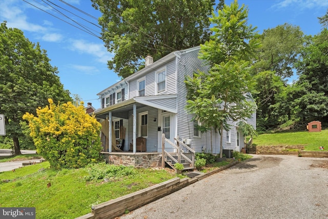 523 Bloomfield Ave, Drexel Hill, PA 19026 - view of front facade featuring a porch and a chimney
