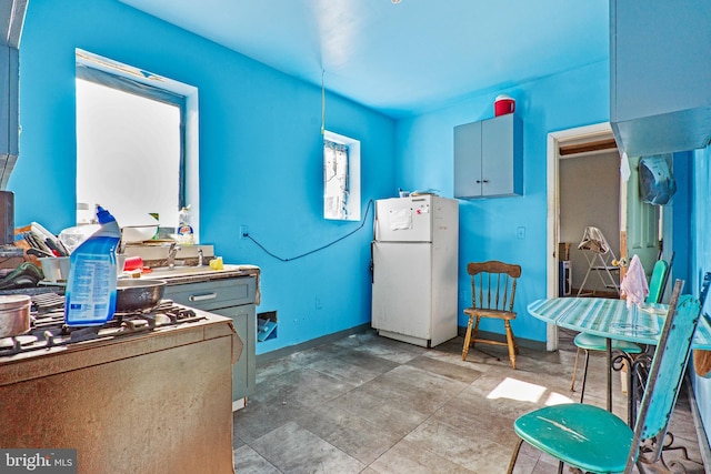 3310 E Lombard St, Baltimore, MD 21224 - kitchen with freestanding refrigerator and baseboards