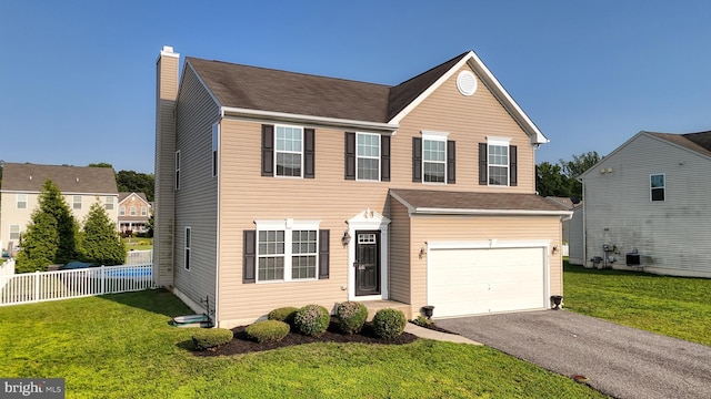 637 Coldwater Dr, Clayton, DE 19938 - traditional home featuring driveway, an attached garage, and a chimney
