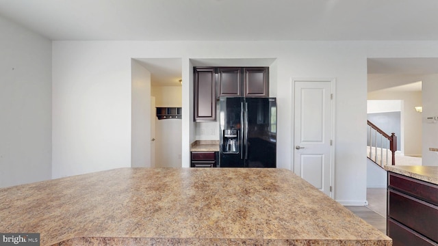 637 Coldwater Dr, Clayton, DE 19938 - kitchen with black fridge with ice dispenser, light countertops, wood finished floors, and dark brown cabinets