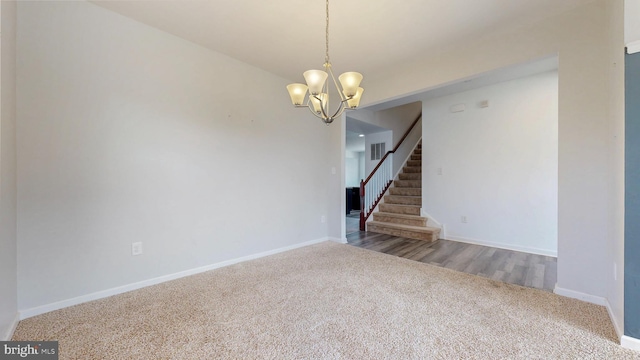 637 Coldwater Dr, Clayton, DE 19938 - empty room with carpet floors, a chandelier, baseboards, and stairway
