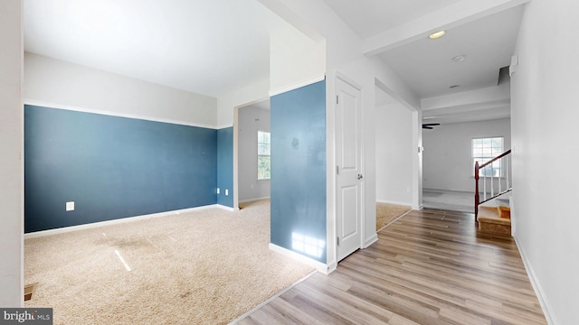 637 Coldwater Dr, Clayton, DE 19938 - spare room featuring healthy amount of natural light, baseboards, wood finished floors, and stairs