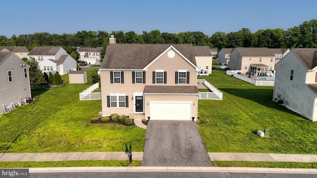 637 Coldwater Dr, Clayton, DE 19938 - traditional home with a residential view, a garage, driveway, and a chimney