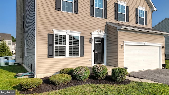 637 Coldwater Dr, Clayton, DE 19938 - view of front facade featuring an attached garage and asphalt driveway