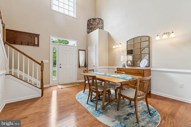 633 Ruxton Rd Unit 75, Solomons, MD 20688 - dining area with plenty of natural light, stairway, light wood-style floors, and a high ceiling