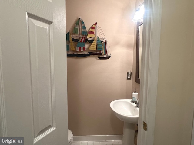 633 Ruxton Rd Unit 75, Solomons, MD 20688 - bathroom with tile patterned floors, toilet, and a sink