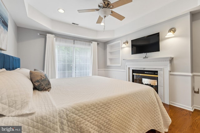 633 Ruxton Rd Unit 75, Solomons, MD 20688 - bedroom with wood finished floors, baseboards, a glass covered fireplace, recessed lighting, and ceiling fan
