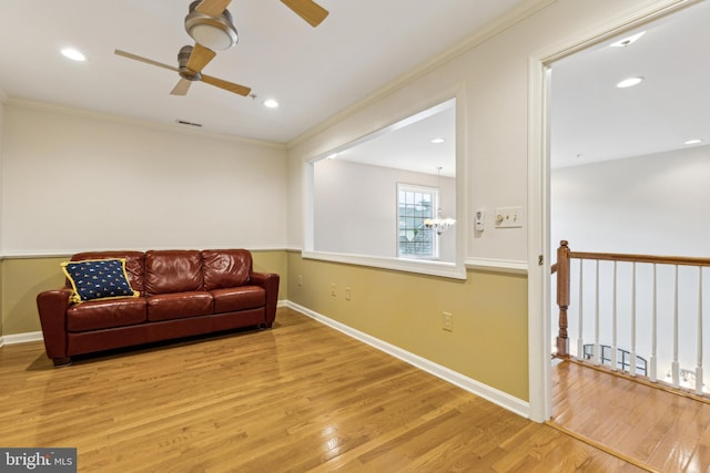 633 Ruxton Rd Unit 75, Solomons, MD 20688 - living area featuring a ceiling fan, wood finished floors, crown molding, baseboards, and recessed lighting