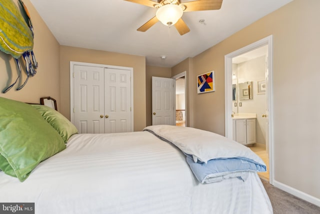 633 Ruxton Rd Unit 75, Solomons, MD 20688 - bedroom featuring a closet, light carpet, baseboards, ensuite bathroom, and ceiling fan
