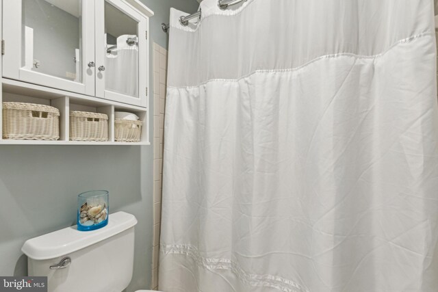 633 Ruxton Rd Unit 75, Solomons, MD 20688 - bathroom featuring toilet and a shower with shower curtain