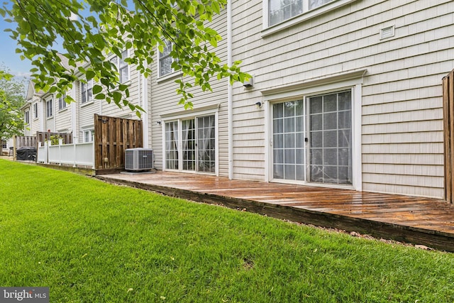 633 Ruxton Rd Unit 75, Solomons, MD 20688 - view of yard featuring a deck and central AC