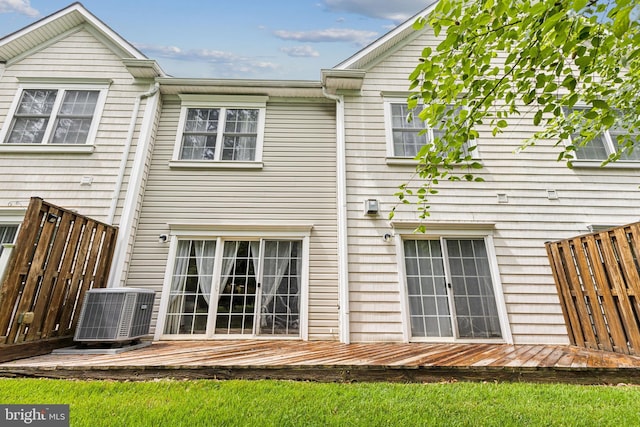 633 Ruxton Rd Unit 75, Solomons, MD 20688 - back of house featuring central AC and a wooden deck