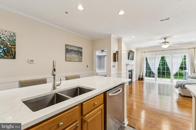 633 Ruxton Rd Unit 75, Solomons, MD 20688 - kitchen featuring a sink, dishwasher, open floor plan, ceiling fan, and brown cabinets