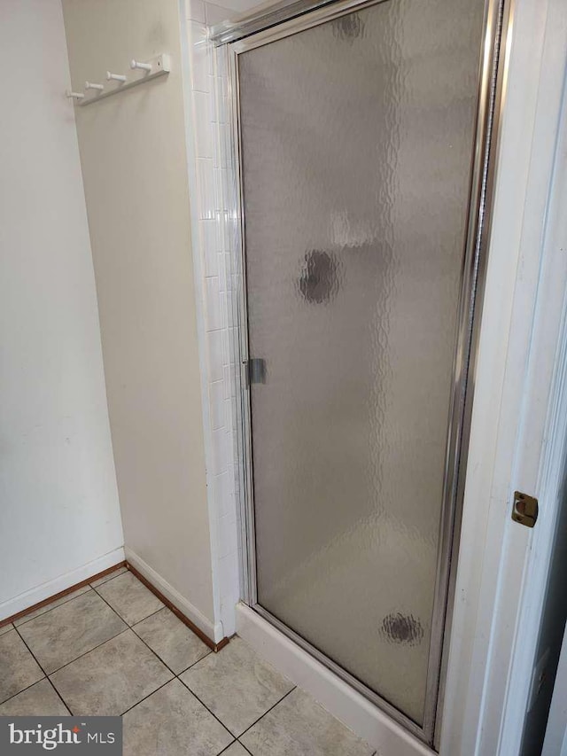 672 Jupiter Hills Ct, Arnold, MD 21012 - bathroom featuring tile patterned flooring, a shower stall, and baseboards