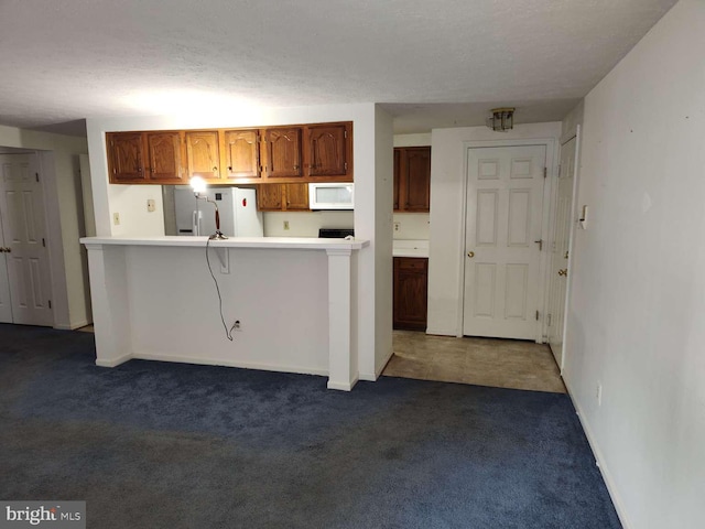 672 Jupiter Hills Ct, Arnold, MD 21012 - kitchen featuring white appliances, dark colored carpet, light countertops, and baseboards