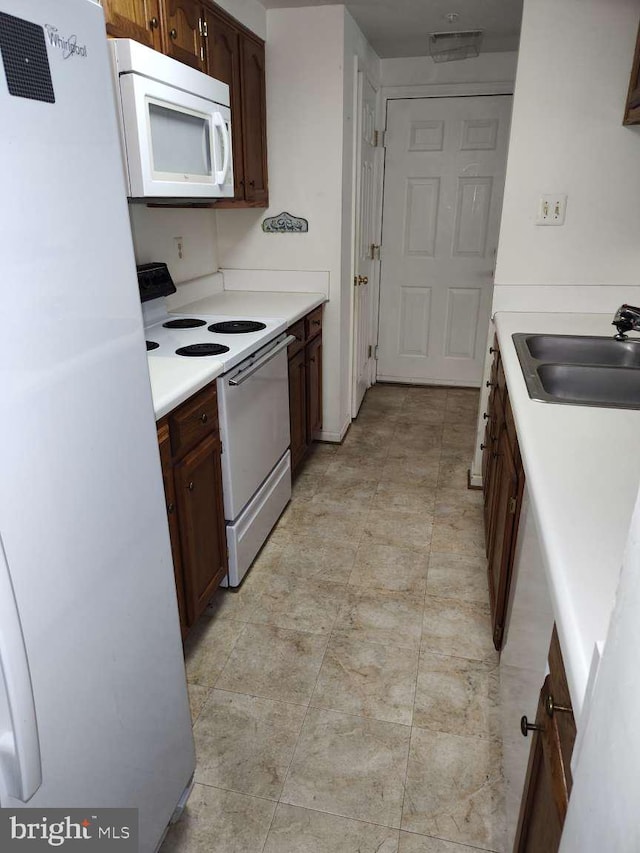 672 Jupiter Hills Ct, Arnold, MD 21012 - kitchen featuring white appliances, a sink, and light countertops