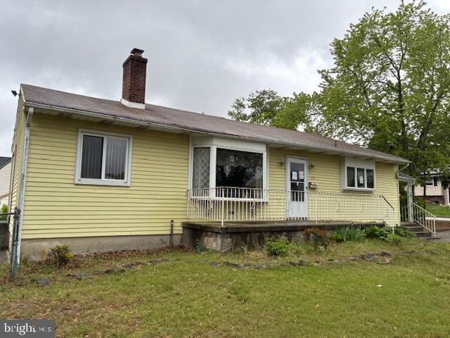 215 4th Ave, West Berlin, NJ 08091 - rear view of property with a yard and a chimney