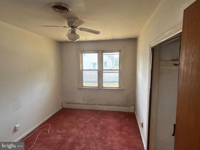 215 4th Ave, West Berlin, NJ 08091 - unfurnished bedroom featuring baseboard heating, carpet flooring, a closet, and ceiling fan