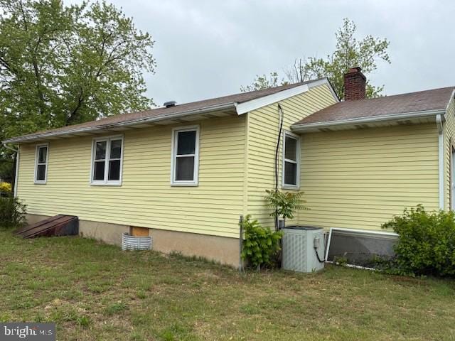 215 4th Ave, West Berlin, NJ 08091 - view of property exterior with cooling unit, a chimney, and a yard