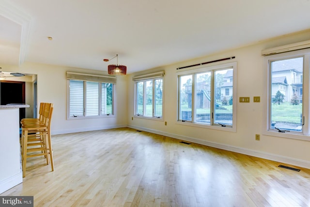 22 Slayback Dr, Princeton Junction, NJ 08550 - unfurnished living room with light wood-style floors and baseboards