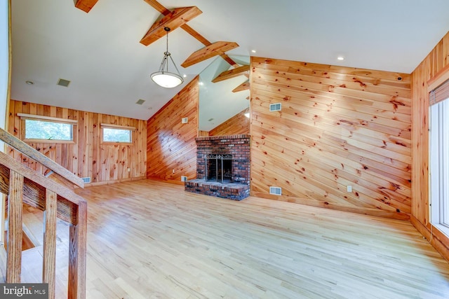 22 Slayback Dr, Princeton Junction, NJ 08550 - unfurnished living room with wood walls, wood finished floors, beam ceiling, high vaulted ceiling, and a fireplace