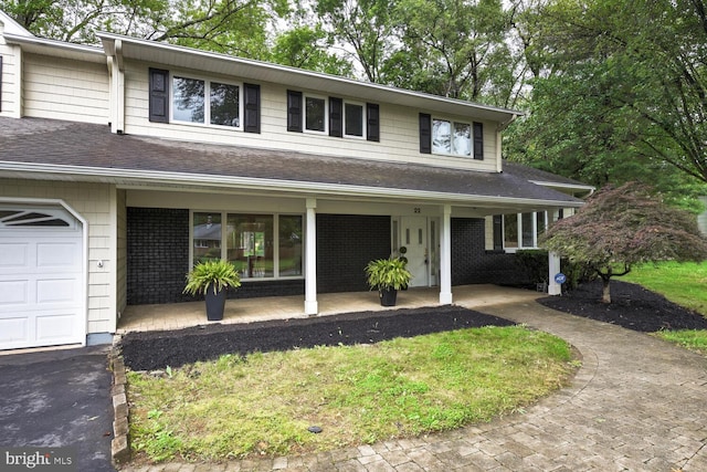 22 Slayback Dr, Princeton Junction, NJ 08550 - view of front of home featuring covered porch, a shingled roof, and asphalt driveway