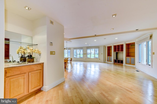 22 Slayback Dr, Princeton Junction, NJ 08550 - unfurnished living room with light wood-style floors and recessed lighting