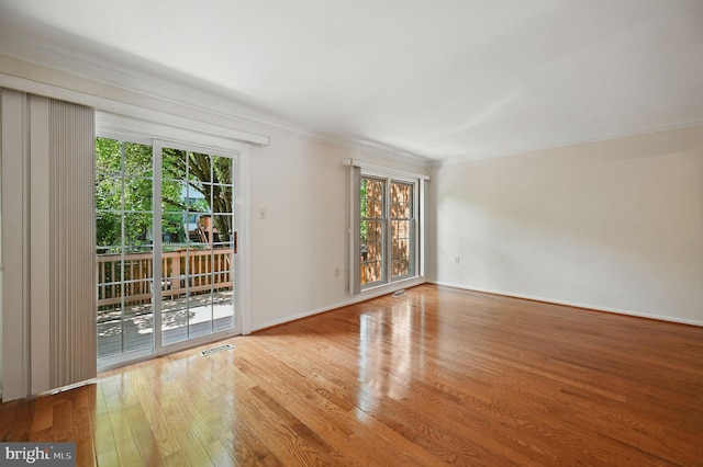 11707 Critton Cir, Woodbridge, VA 22192 - empty room with wood finished floors and crown molding