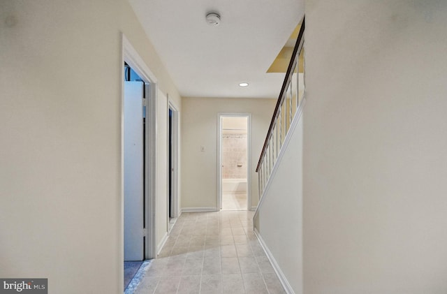 11707 Critton Cir, Woodbridge, VA 22192 - hall featuring light tile patterned floors, recessed lighting, and stairs