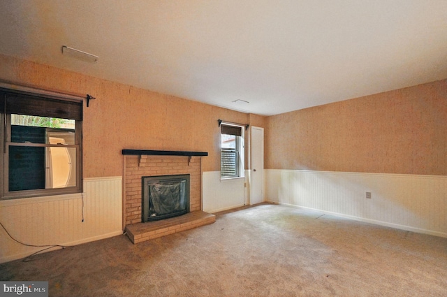 11707 Critton Cir, Woodbridge, VA 22192 - unfurnished living room with wainscoting, carpet floors, and a brick fireplace