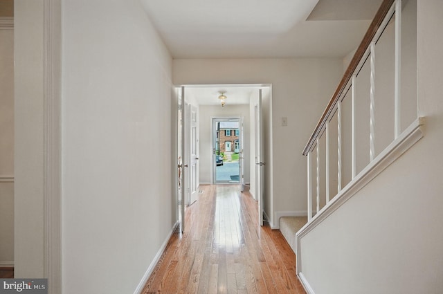 11707 Critton Cir, Woodbridge, VA 22192 - corridor featuring light wood finished floors and stairway