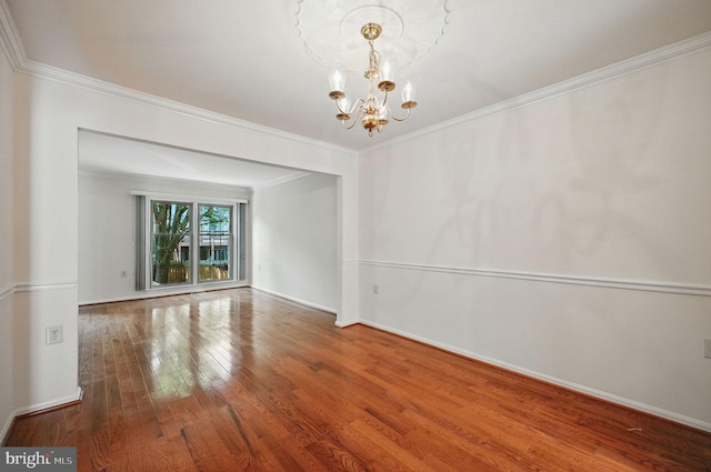 11707 Critton Cir, Woodbridge, VA 22192 - spare room with a chandelier, hardwood / wood-style floors, and crown molding