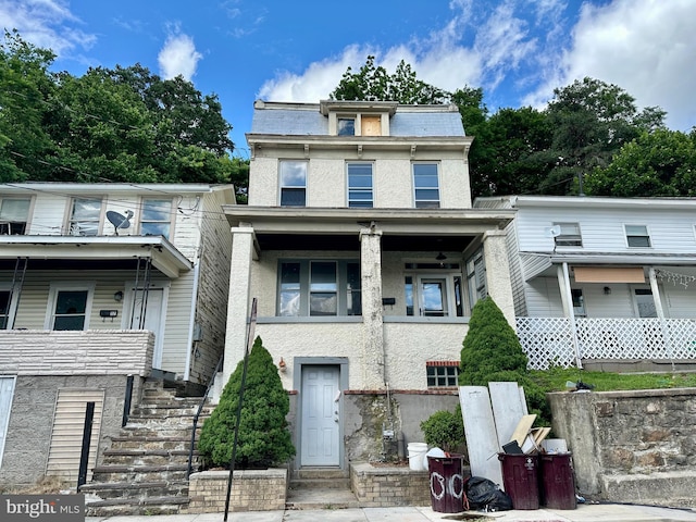 115 Bellevue St, Cumberland, MD 21502 - victorian home with stairs, mansard roof, and stucco siding