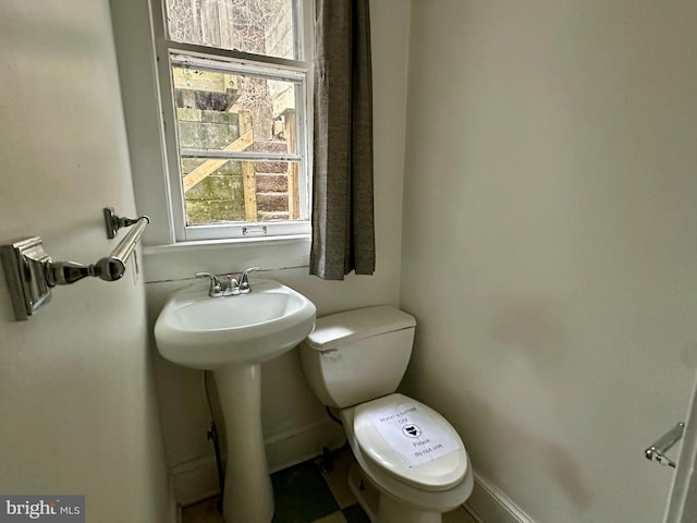 115 Bellevue St, Cumberland, MD 21502 - bathroom with plenty of natural light, toilet, and baseboards