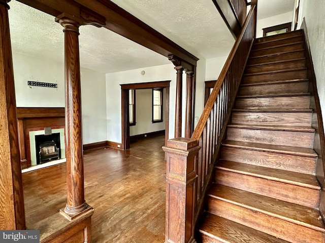 115 Bellevue St, Cumberland, MD 21502 - stairway with wood finished floors, a textured ceiling, and baseboards