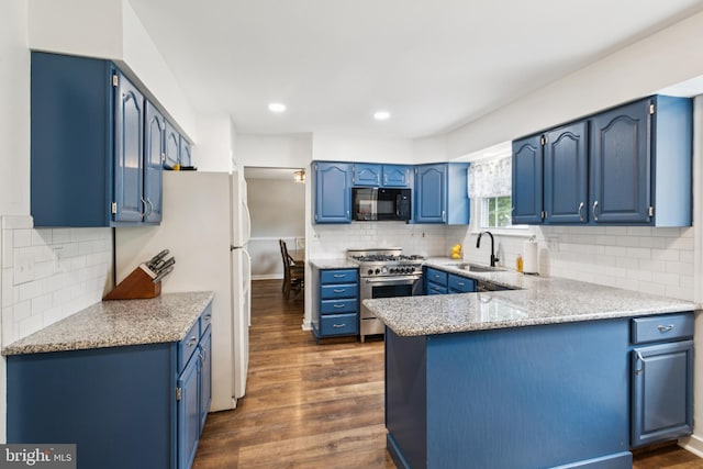 20 Hydra Ln, Sewell, NJ 08080 - kitchen with black microwave, high end stove, a sink, blue cabinetry, and dark wood-style floors