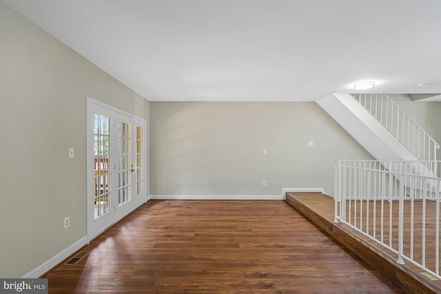 8530 Raglan Rd, Vienna, VA 22182 - unfurnished living room with wood finished floors and stairway
