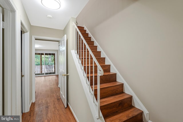 8530 Raglan Rd, Vienna, VA 22182 - stairs featuring wood finished floors and baseboards