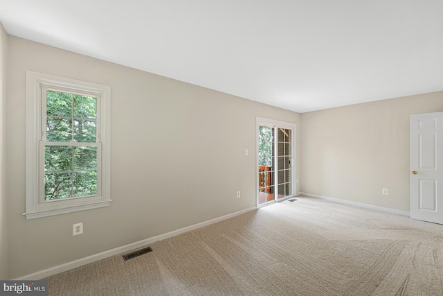 8530 Raglan Rd, Vienna, VA 22182 - carpeted empty room featuring plenty of natural light