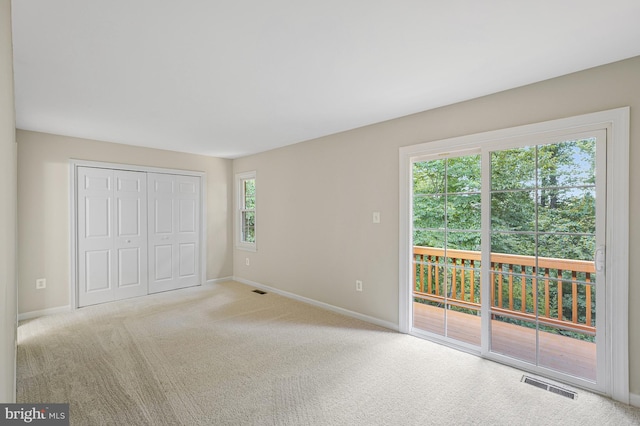 8530 Raglan Rd, Vienna, VA 22182 - unfurnished bedroom with access to exterior, carpet flooring, and a closet