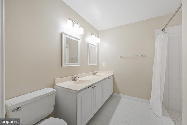 8530 Raglan Rd, Vienna, VA 22182 - full bath featuring double vanity, tiled shower, and tile patterned floors
