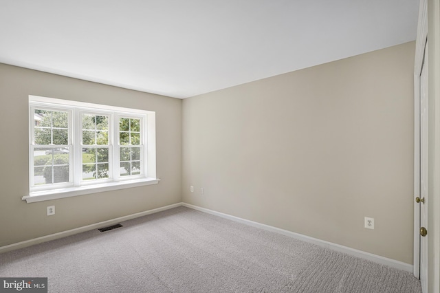 8530 Raglan Rd, Vienna, VA 22182 - spare room featuring baseboards and carpet