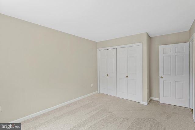 8530 Raglan Rd, Vienna, VA 22182 - unfurnished bedroom with light carpet and a closet