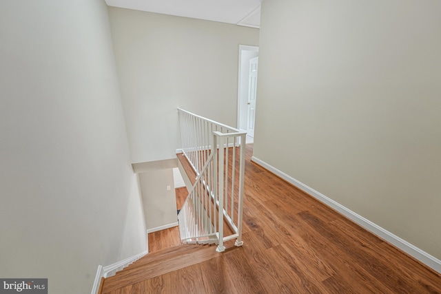 8530 Raglan Rd, Vienna, VA 22182 - staircase featuring wood finished floors and baseboards