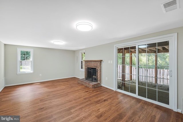 8530 Raglan Rd, Vienna, VA 22182 - unfurnished living room featuring wood finished floors and a fireplace
