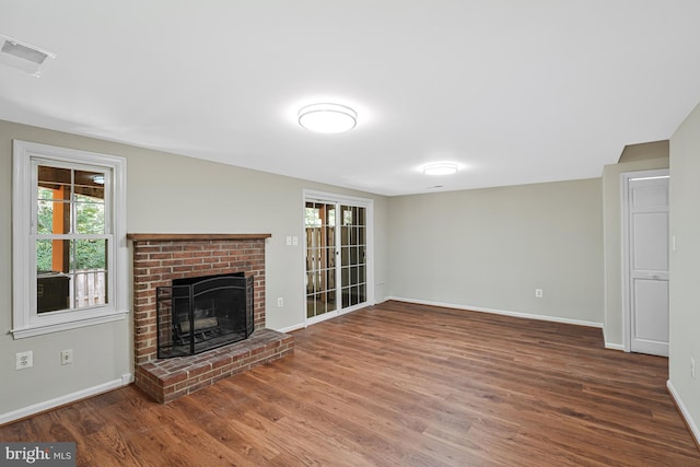8530 Raglan Rd, Vienna, VA 22182 - unfurnished living room with wood finished floors and a fireplace