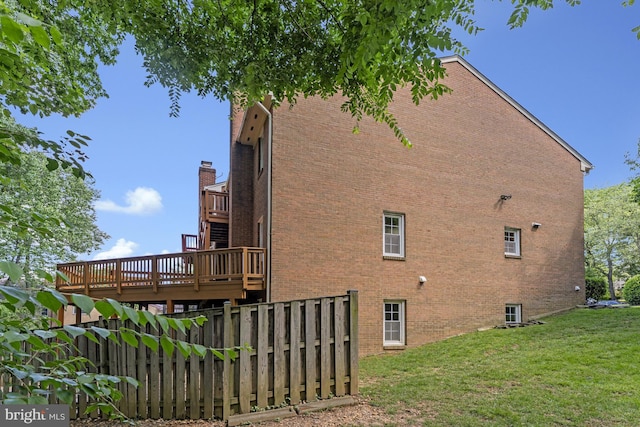 8530 Raglan Rd, Vienna, VA 22182 - view of side of property featuring brick siding and a wooden deck