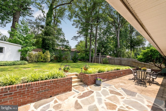 7407 Falmouth St, Springfield, VA 22150 - fenced backyard with a patio area and outdoor dining area