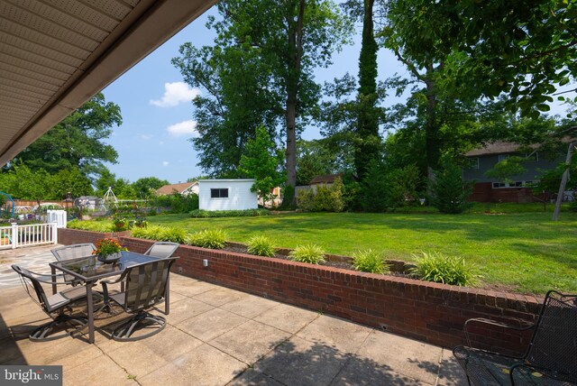 7407 Falmouth St, Springfield, VA 22150 - view of patio / terrace with outdoor dining area and an outbuilding