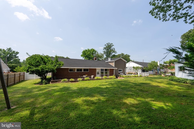 7407 Falmouth St, Springfield, VA 22150 - rear view of house with brick siding and a chimney